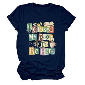 Close-up of "I Closed My Book To Be Here" colorful graphic print on navy t-shirt