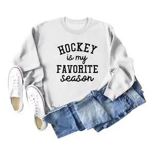 Close-up of white crewneck sweatshirt with Hockey Is My Favorite Season slogan