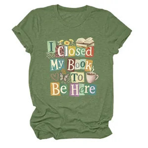 Green crew neck T-shirt featuring 'I Closed My Book To Be Here' graphic design