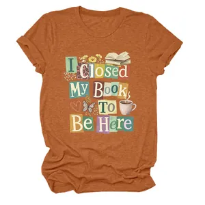 Detail view of the colorful graphic print on a terracotta orange crew neck T-shirt.