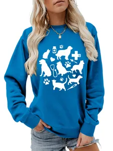 Close-up of blue women's sweatshirt featuring cute white pet and medical graphic prints