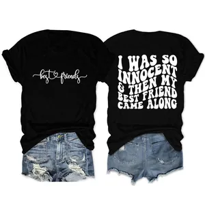 Λεπτομερής εμφάνιση μαύρου T-shirt με σλόγκαν Best Friends και Innocent με τζιν σορτς