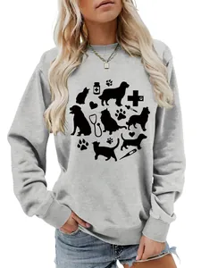 Close-up of a grey sweatshirt featuring black silhouettes of pets and medical tools