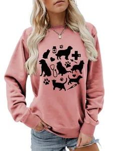 Detailed view of women's pink sweatshirt featuring cute cat dog and stethoscope print