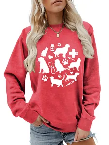 Detail of red sweatshirt featuring white cat and dog silhouettes with stethoscope print