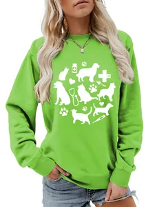 Detail view of cute white cat, dog, paw and stethoscope print on bright green sweatshirt
