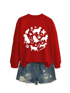 Detail of the veterinary themed print featuring cat and dog silhouettes on a red sweatshirt
