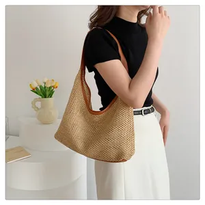 Fashionable woven large capacity underarm tote bag shown in a casual lifestyle setting