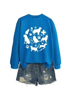 Detail of blue sweatshirt with cute cat dog and medical icons print paired with denim shorts