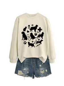 Detail view of a cream sweatshirt with cute cat, dog, and veterinarian prints.