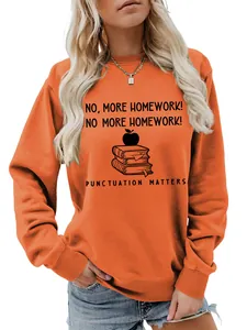 Close-up of women's orange crewneck sweatshirt featuring a punctuation-themed print.
