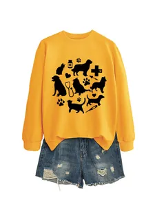 Yellow long-sleeve sweatshirt with cat and dog paw print design and denim shorts