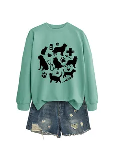Detailed view of cat and dog paw print graphic on mint green women's sweatshirt