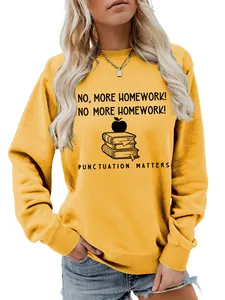 Detail view of yellow ladies crewneck sweatshirt with 'No More Homework' graphic print