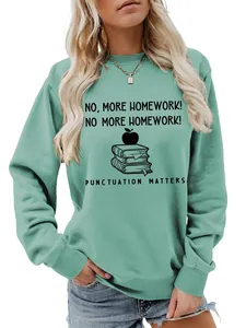 Detail view of mint green crew neck sweatshirt with 'No More Homework' graphic print