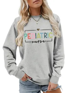 Detailed macro view of a grey pediatric nurse crewneck sweatshirt with colorful text print