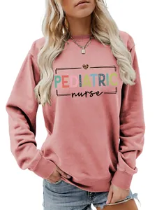 Close-up detail of a pink women's pediatric nurse sweatshirt with vibrant typography