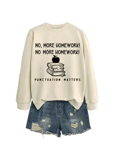 Detail of a cream crewneck sweatshirt with Punctuation Matters school-themed graphic.
