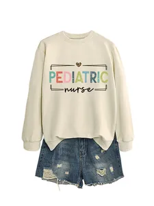 Detailed view of pediatric nurse graphic print on a cream-colored long sleeve sweatshirt