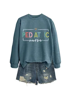 Women's blue pediatric nurse crewneck sweatshirt styled with distressed denim shorts