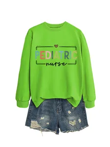 Close-up detail of pediatric nurse graphic on a vibrant lime green crewneck sweatshirt