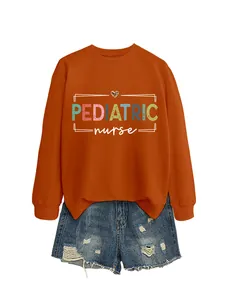 Detailed close-up of pediatric nurse graphic print on a burnt orange crewneck sweatshirt.