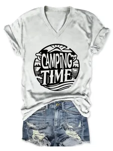 Close-up of women's V-neck T-shirt with 'Camping Time' graphic print and denim shorts
