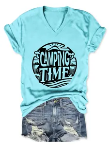 Detail of a light blue V-neck T-shirt with a Camping Time graphic and denim shorts