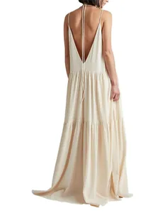 Back view showing thin straps and pleated texture of this cream summer maxi dress
