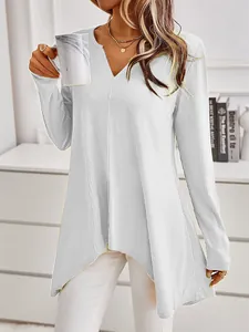 Close-up of elegant women's ribbed knit sweater with V-neck and asymmetrical hem
