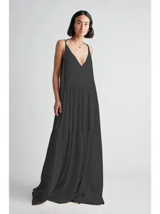 Elegant black summer tiered maxi dress with pleated texture and stylish slim straps