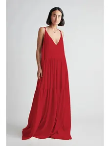 Full-length studio view of an elegant red tiered maxi dress featuring a deep V-neckline.