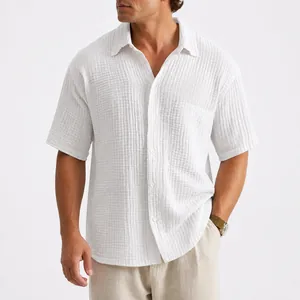 Men's loose white short-sleeved casual shirt with textured fabric for summer wear.
