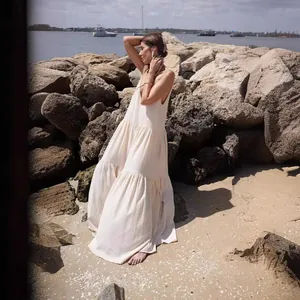 Elegant off-white tiered maxi beach dress with pleated loose fit for summer holidays.