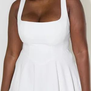 Close-up of an elegant white sleeveless square neck midi dress with a slim fit waist design