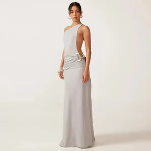 Elegant light grey one-shoulder backless maxi dress featuring a metallic ring waist detail.