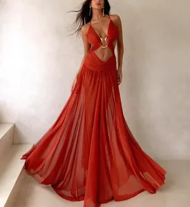 Close-up detail showing a sexy red cut-out maxi dress with a decorative golden buckle