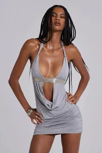 Close-up detail of sexy grey halter mini dress featuring a deep V-cut and center cutout