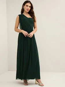 Elegant dark green one-shoulder pleated maxi evening gown for women in a studio setting