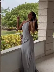 Elegant one-shoulder backless maxi dress in light grey for a sophisticated evening look.