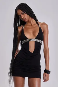 Close-up of sexy black halter mini dress with cutout deep V-neck and studded details