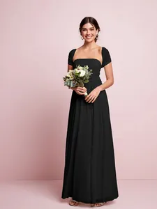 Detailed view of an elegant black multi-way pleated maxi dress for wedding bridesmaids