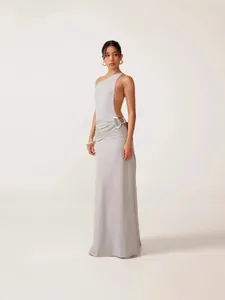 Elegant one-shoulder backless long dress in light grey with ruched waist detail.
