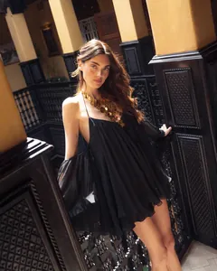 Elegant black halter cold shoulder chiffon mini dress with dramatic flared sleeves.