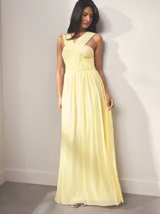 Elegant pale yellow floor-length pleated evening gown featuring a cross-over halter neck