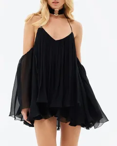 Detailed close-up view of a black pleated chiffon halter-neck mini dress model