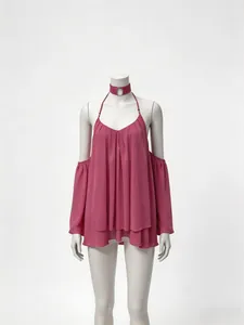 Detail of a dark pink chiffon halter top with cold-shoulder sleeves and ruffled hem.