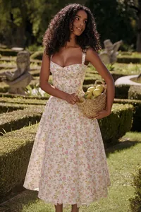 Floral cottagecore dress detail featuring corset bodice and lemon basket accessory
