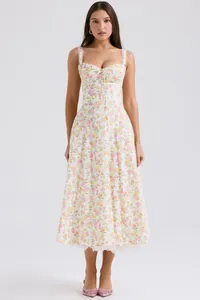 Detailed view of a floral sundress featuring a sweetheart neckline and lace-up front.