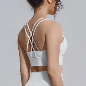 Dettaglio del reggiseno sportivo bianco con spalline incrociate e design antiurto.